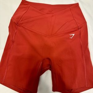 Gymshark crossover shorts, size small, pomegranate red. Brand new, didn’t fit me